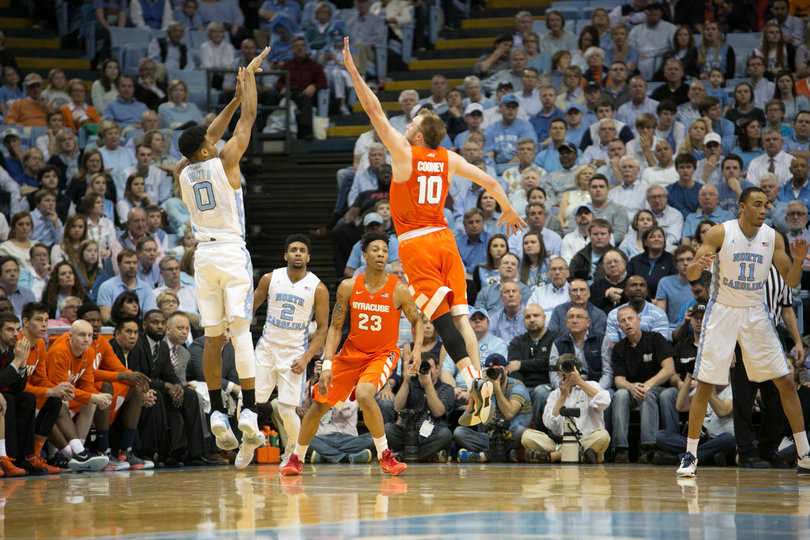 Cooney leaps to challenge UNC guard Britt's shot in Syracuse's 75-70 loss.   