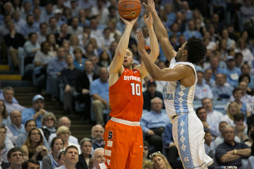 Cooney lines up a 3-pointer over North Carolina guard Berry. He finished with 14 points and hit 3-of-11 shots from the field. 