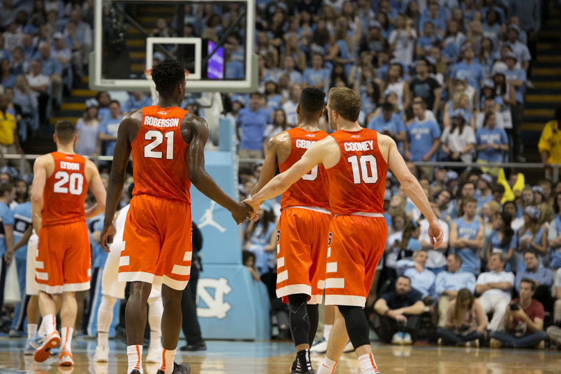 Cooney and Roberson slap hands. The two combined for 23 points. Cooney finished the game 6-of-6 from the free-throw line. 