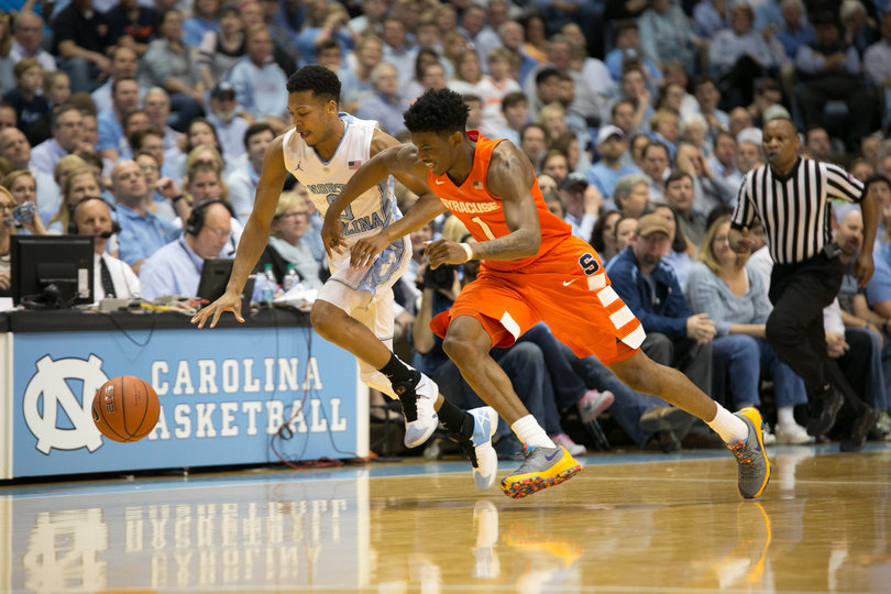 Frank Howard and Nate Britt chase down a loose ball near the sideline. Howard turned the ball over twice and assisted on one bucket. 