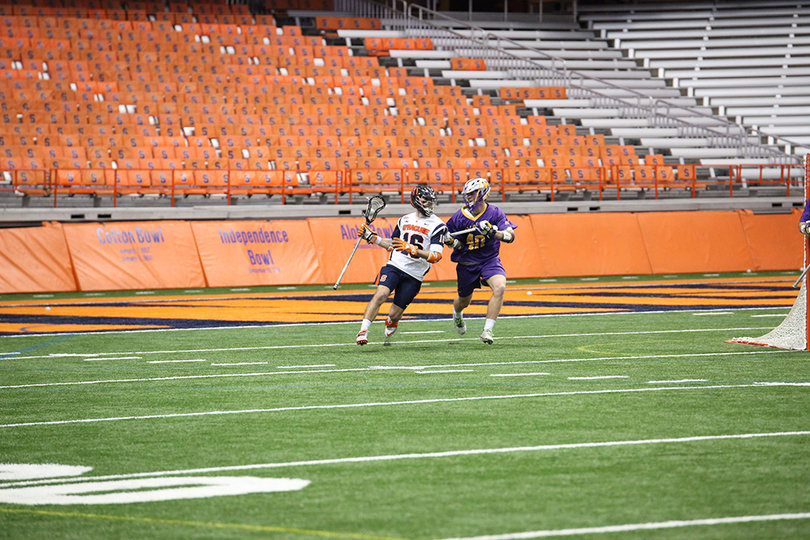Second-line midfielder Ryan Simmons cradles the ball behind the net. He didn't record a point in the game.