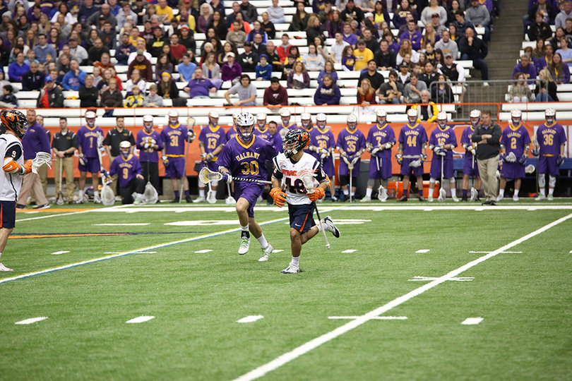 Sergio Salcido runs down the field with the stick in his left hand. He had a goal and two assists.