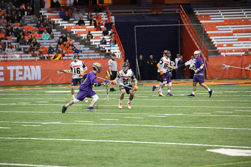 Mellen stands his ground as Fields prepares to make a dodge. The freshman defender had five ground balls and a caused turnover.