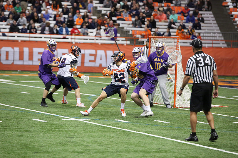 Junior attack Jordan Evans stands with his back to the goal. He had two of the Orange's 16 goals.