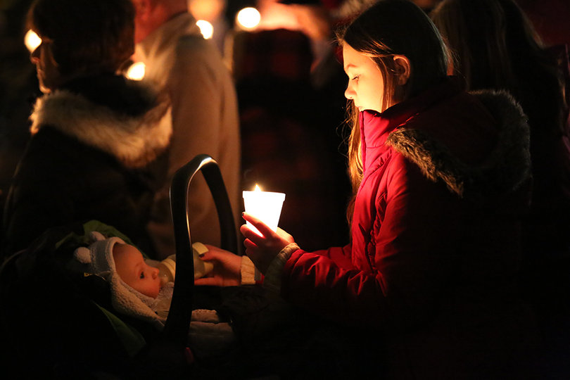 Ellie Granger and her nephew listen on at Wednesday's vigil.