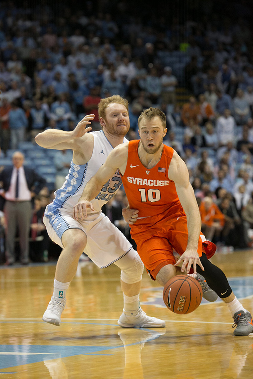 Cooney drives past a defender and into the paint.
