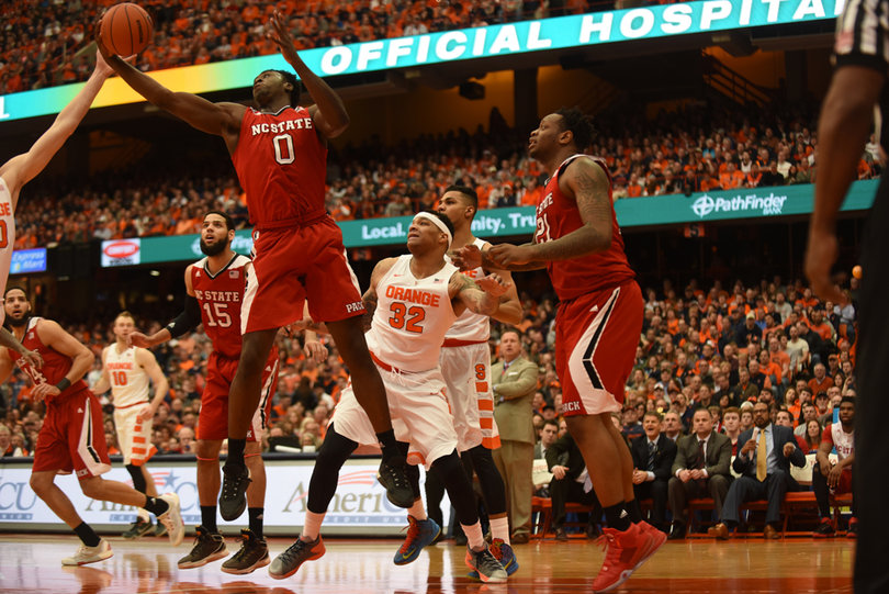 Coleman watches as N.C. State forward Abdul-Malik Abu grabs a rebound. Abu scored 14 points and collected another 12 rebounds. 