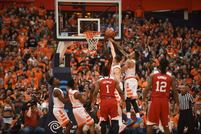 Gbinije and Syracuse big man Tyler Lydon jump for a block during Syracuse's 75-66 win Saturday. 