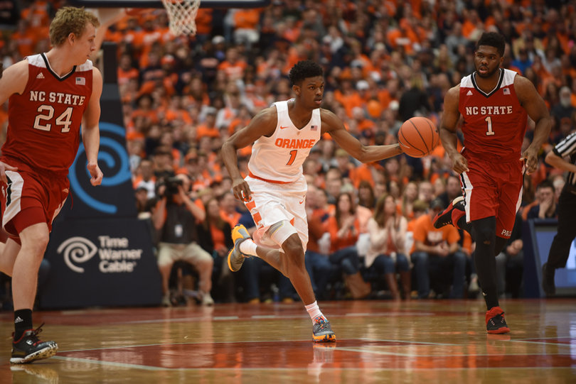 Syracuse backup point guard Frank Howard dribbles down the court Saturday as N.C. State's Lennard Freeman and Maverick Rowan look on. 