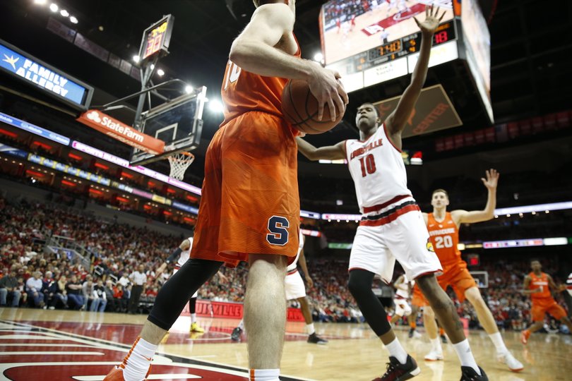 Trevor Cooney attempts to inbound the ball past Johnson as Tyler Lydon moves toward Cooney. 