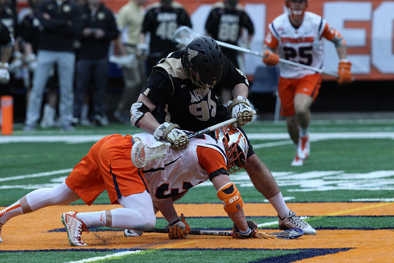 Williams (bottom) goes low while fighting for a faceoff during the first half. Williams' play at the X has been a big factor for the Orange's success so far this season. 