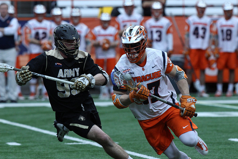 Syracuse faceoff specialist Ben Williams comes around the edge as an Army player gives chase. 