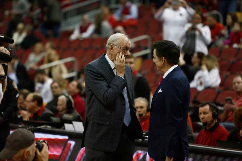 Syracuse head coach Jim Boeheim meets with his former assistant Rick Pitino before SU plays UofL. 