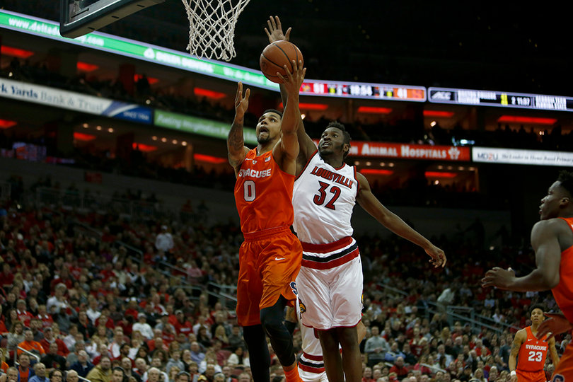 Gbinije rises up for a layup as Louisville's Chinanu Onuaku defends him from behind. Gbinije went 5-of-11 from the field.