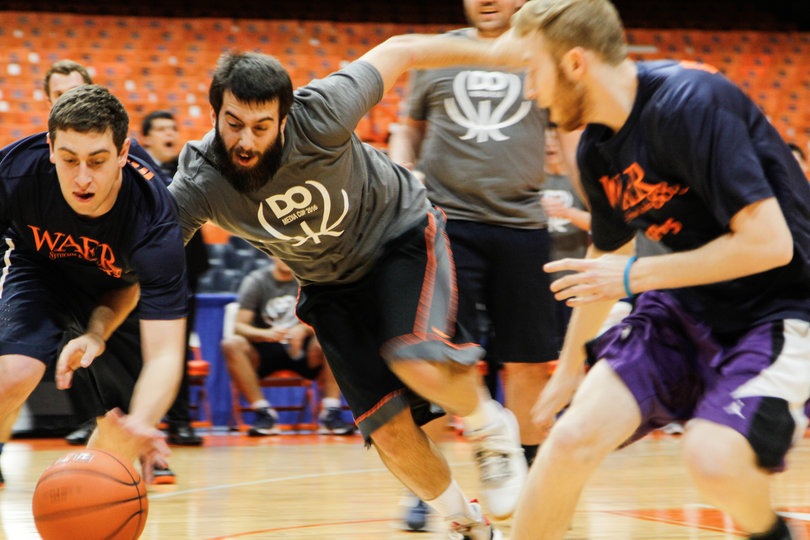 Senior Staff Photographer Logan Reidsma fights for a loose ball. Reidsma was a force down low, especially when it came to rebounding.