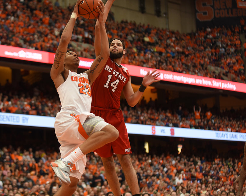 Caleb tries to block Richardson as the Syracuse guard attempts a layup Saturday. 