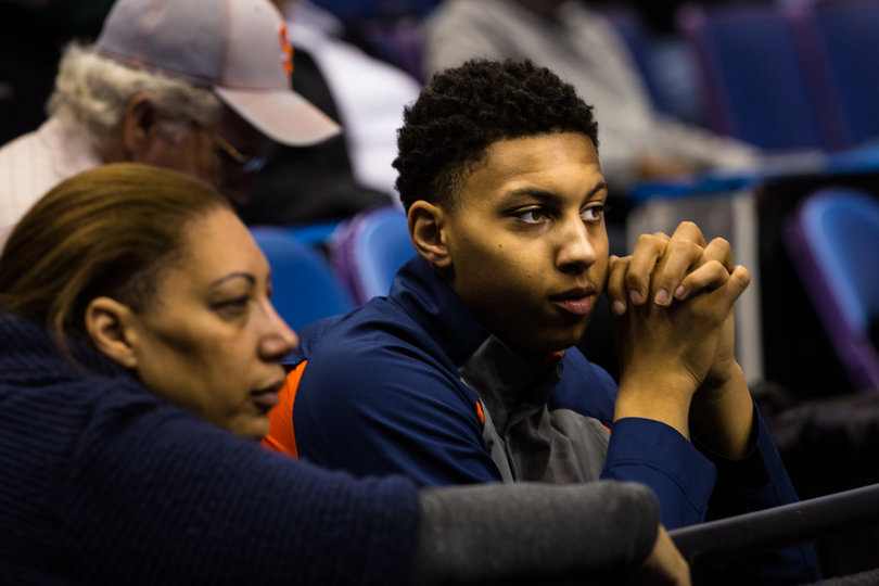 Annette Moyer (left) and her son Matthew, a Syracuse basketball signee, watch Syracuse's open practice on Thursday afternoon.