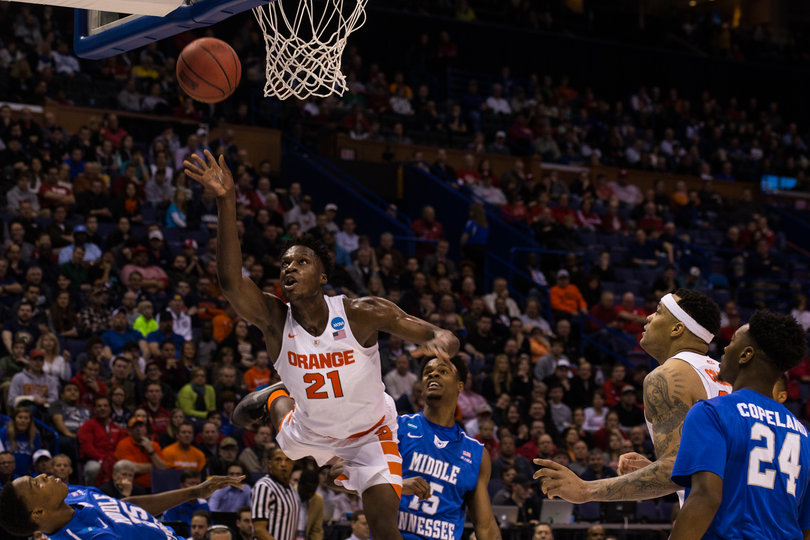 Tyler Roberson throws a right-handed shot toward the basket against Middle Tennessee State on Sunday.
