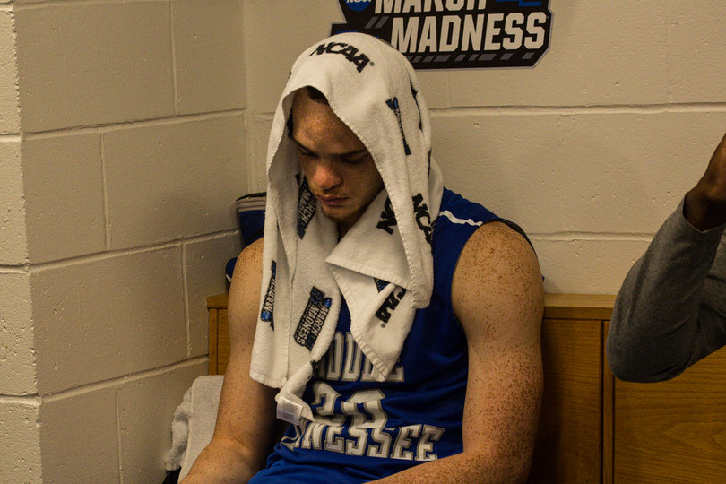 Reggie Upshaw sits in the Blue Raiders' locker room with a towel on his head. After losing to Syracuse, MTSU's magical postseason run came to an end.