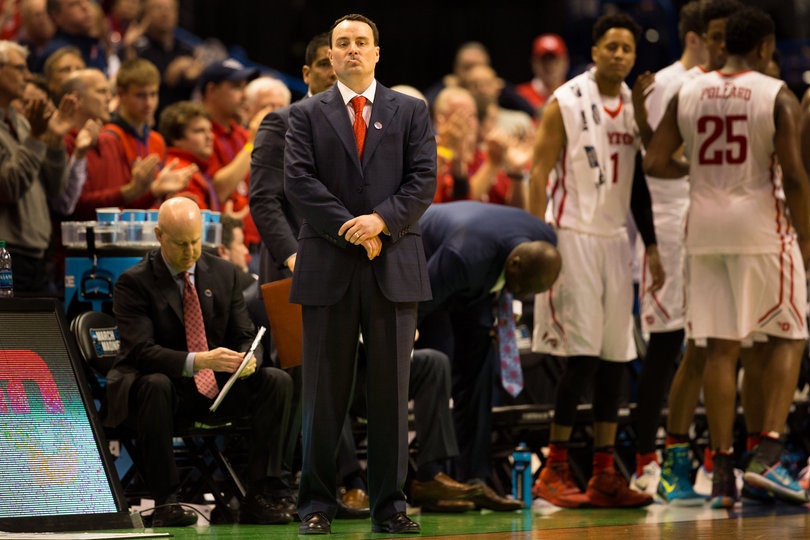 Dayton head coach Archie Miller looks on from in front of the Flyers' bench as Syracuse pulls away. 