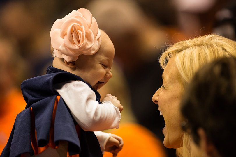 Katie McNamara, wife of SU assistant coach Gerry McNamara, with her baby daughter Grace. 