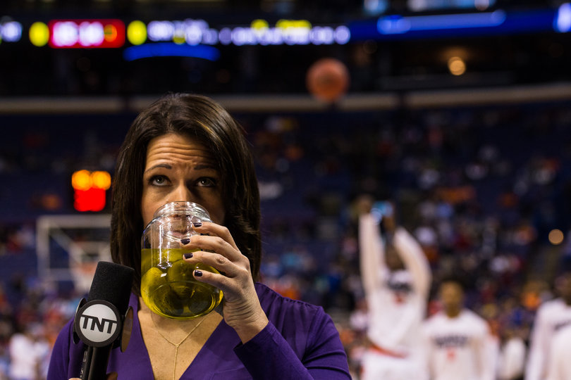 TNT's Dana Jacobsen lifts a jar of pickle juice to her face. Syracuse's Gbinije has drank it throughout the season to help with hydration.