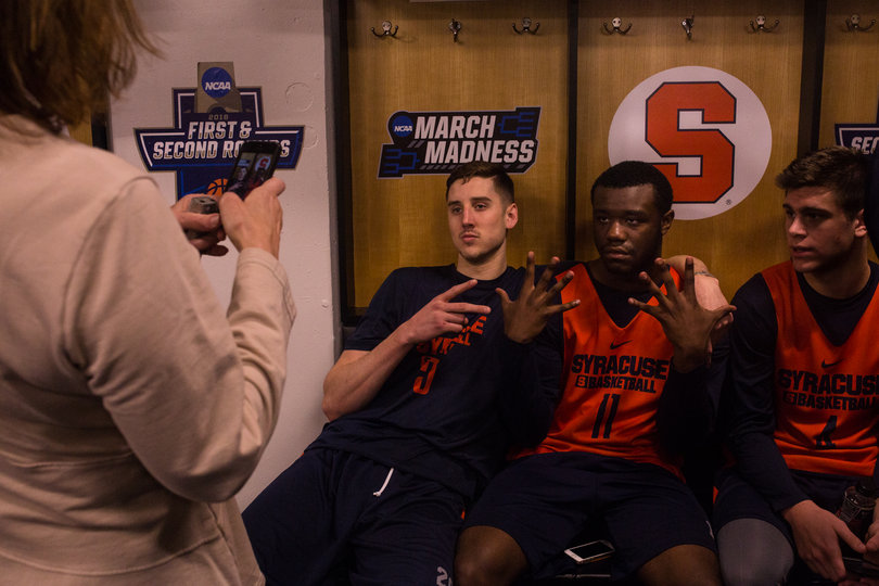 Tyler Lydon and walk-ons Adrian Autry Jr. and Mike Sutton pose for reporters. The Orange practiced at the Scottrade Center earlier on Saturday. 