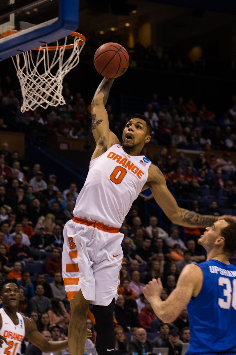 Syracuse's Michael Gbinije elevates for a one-handed dunk in the first half against MTSU.