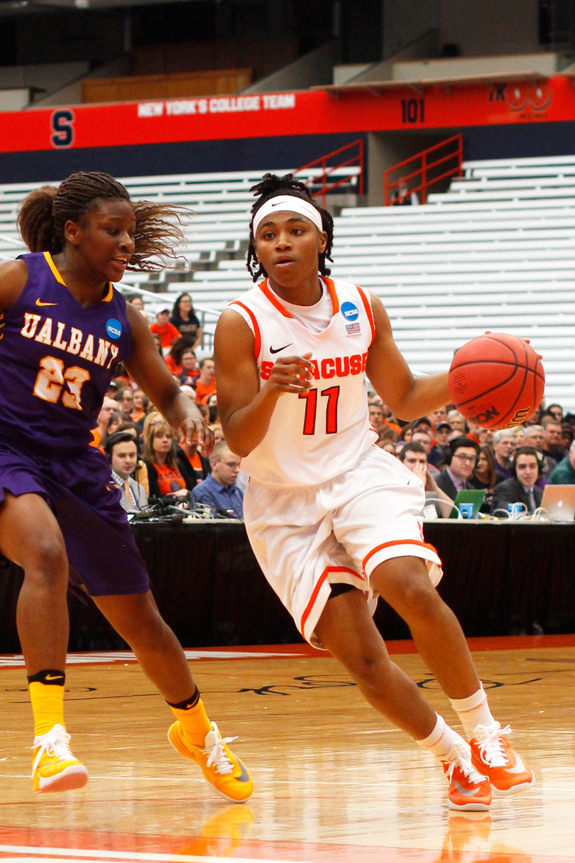 Fondren dribbles past Albany's Saunders. She turned the ball over six times, but chipped in a block and a steal. 