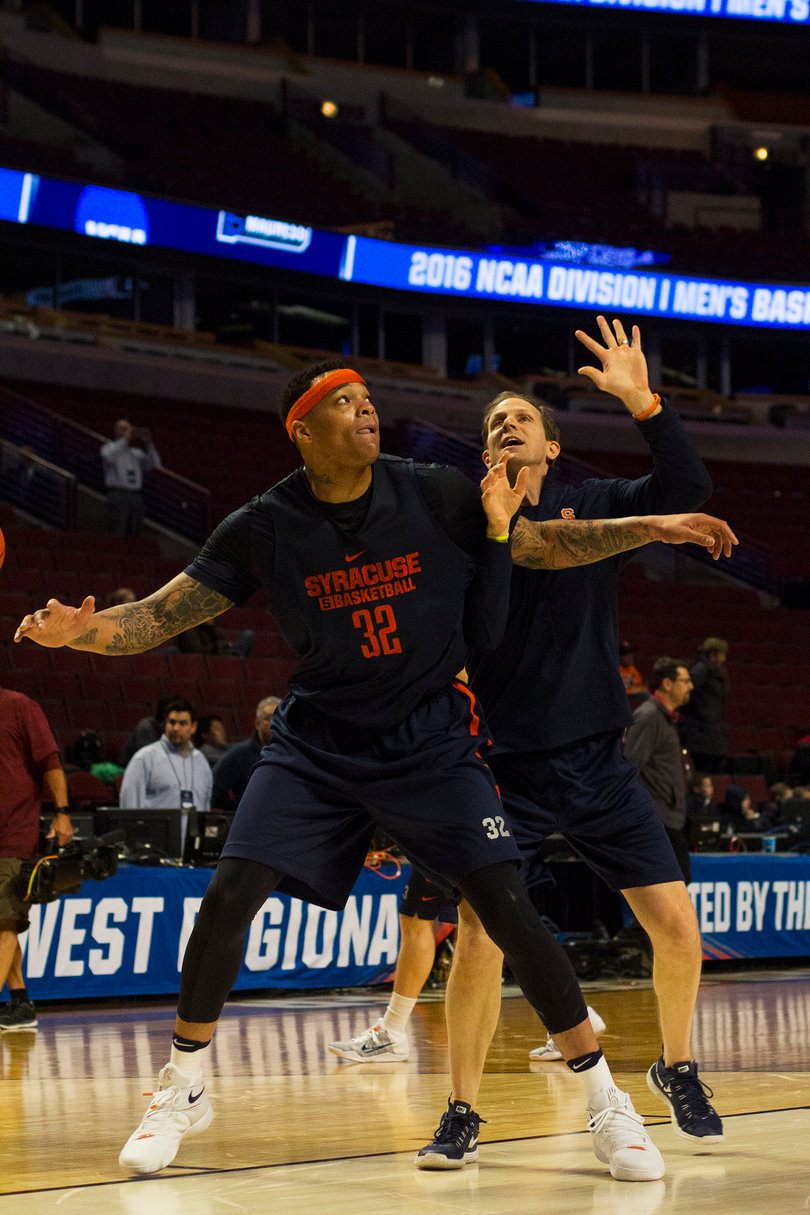 Dajuan Coleman practices boxing out with assistant coach Mike Hopkins. 