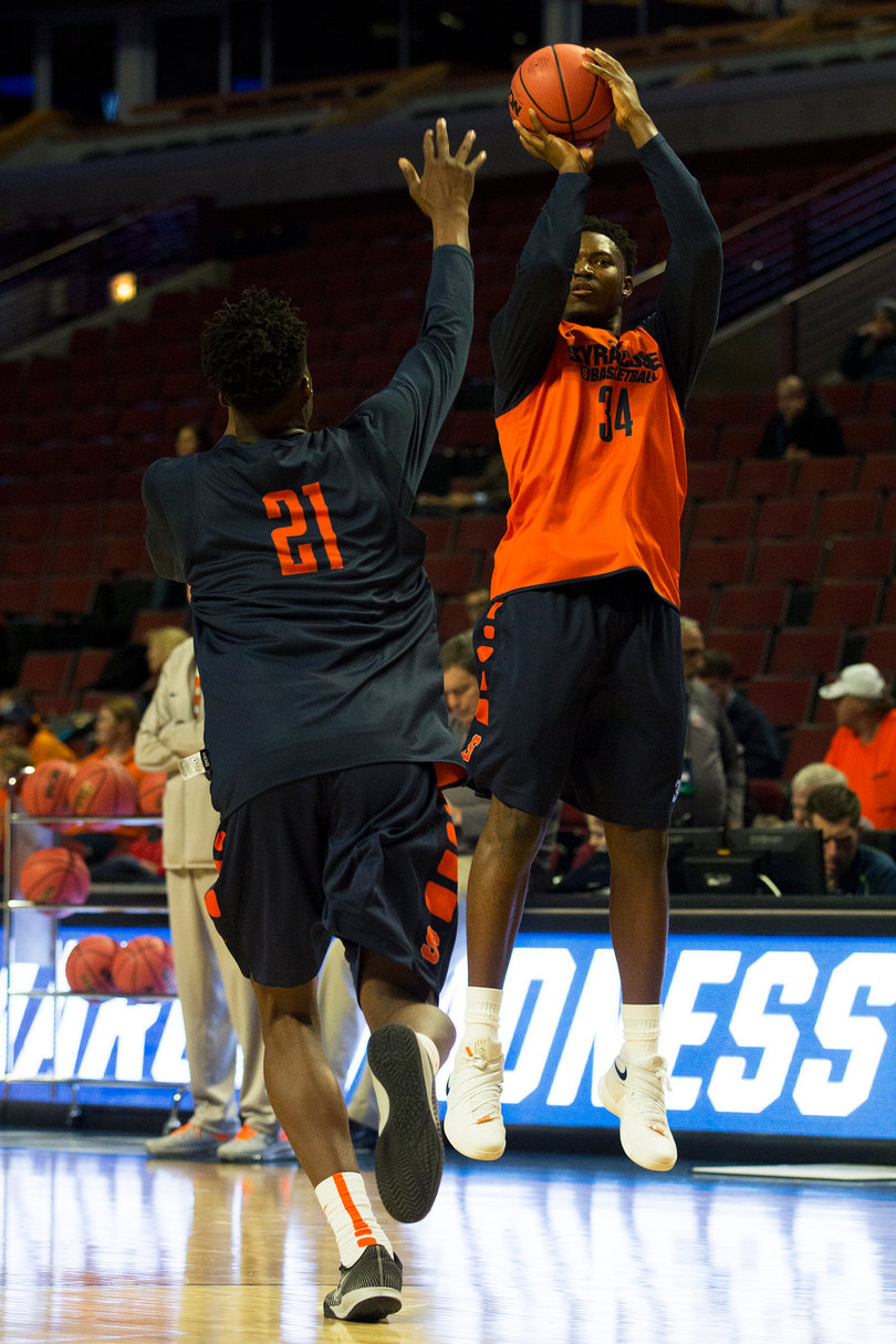 Doyin Akintobi-Adeyeye takes a shot in practice as Roberson closes out. 