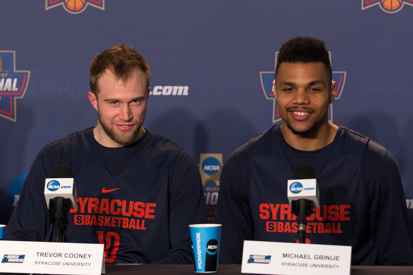 Syracuse's two fifth-year seniors, Trevor Cooney (left) and Michael Gbinije (right), answer questions during Syracuse's media availability on Saturday. 