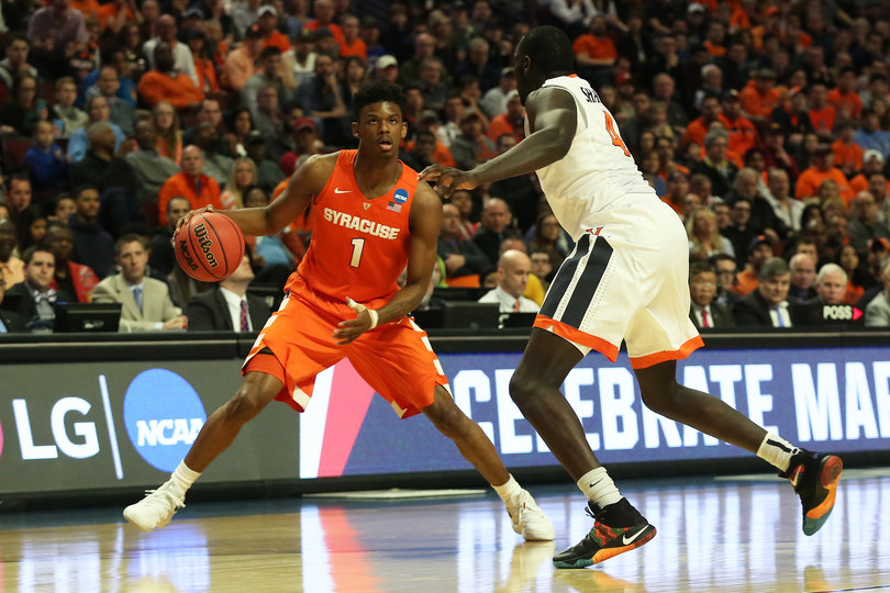 Frank Howard looks to drive against a Virginia defender.