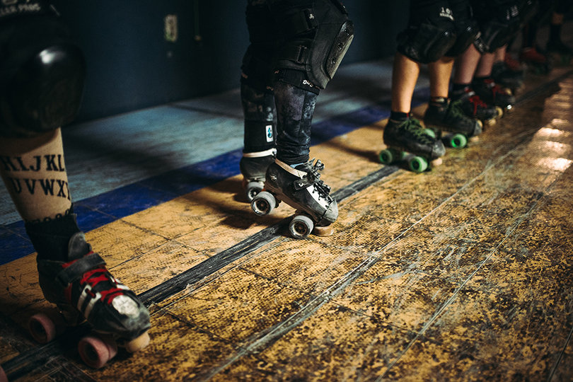 Skaters line up to be split into teams for full-contact capture the flag. 