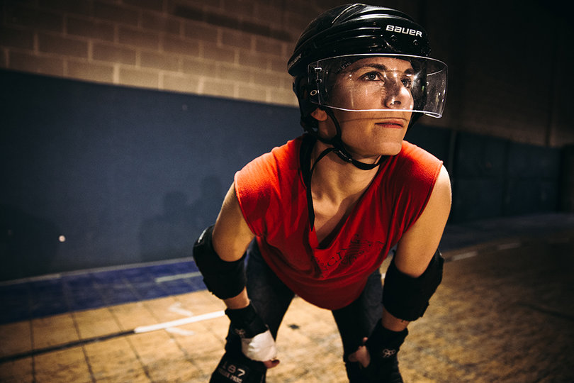 Skaters are clad in protective gear from head to toe. They wear helmets, elbow pads, hand guards and knee pads.