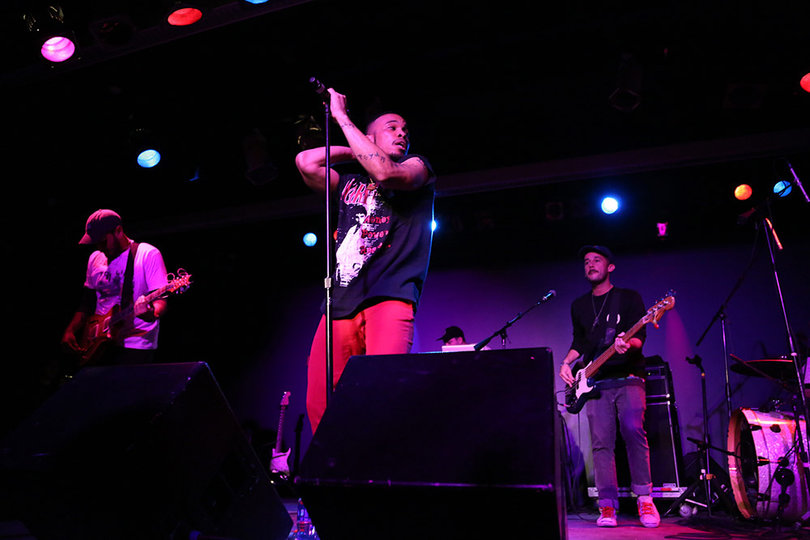 The purple lights and The Free National's synth beats added an edge to .Paak's performance.