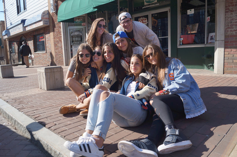 Students pose for a photo on Marshall Street on Sunday before the Elite Eight games began.