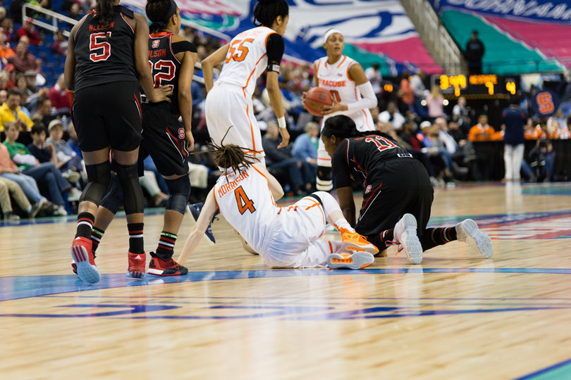 SU guard Maggie Morrison sits on the ground. She had five points off the bench.