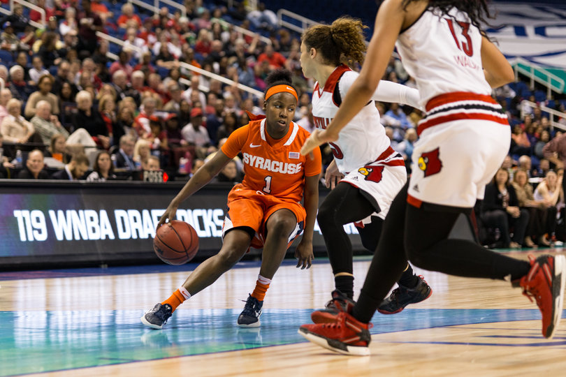 Peterson does a crossover with the ball as Louisville's Briahanna Jackson tries to take it away. She scored a team-high 19 points.