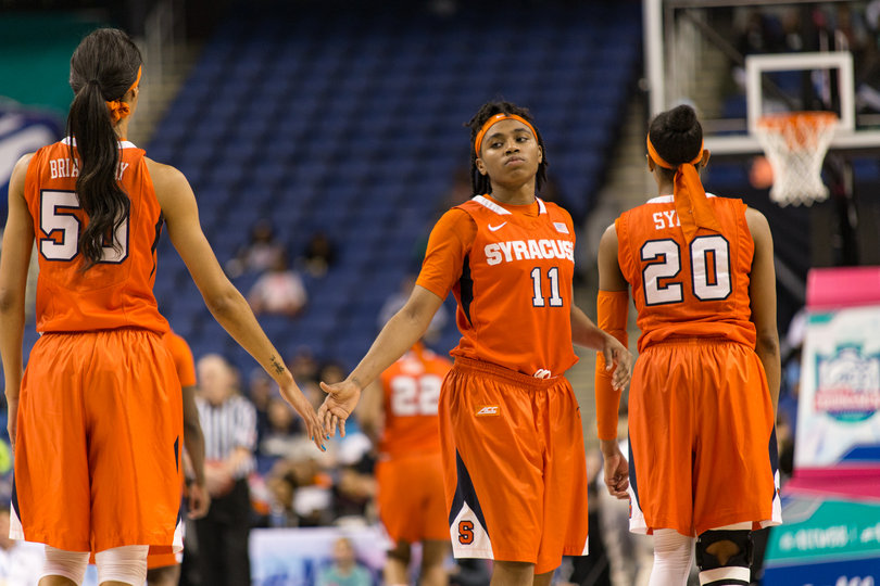 Briana Day and Fondren slap hands. Day grabbed five rebounds and Fondren led the team with 13 to help SU control the paint.