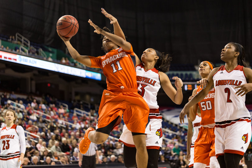 Fondren shoots a layup while Cardinals forward Cortnee Walton tries to block her shot.