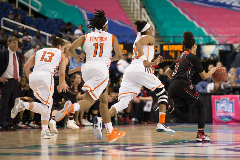 Butler, Fondren and Sykes chase down Spencer, who is dribbling down the court. Spencer finished with 22 points.