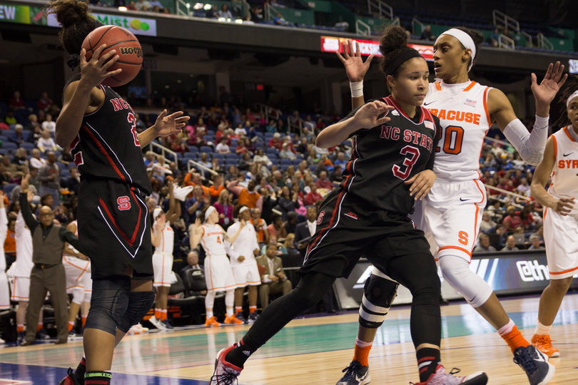Sykes gets in Spencer's way as N.C. State attempts an inbounds pass. The Orange utilized its press to set the game's tempo.