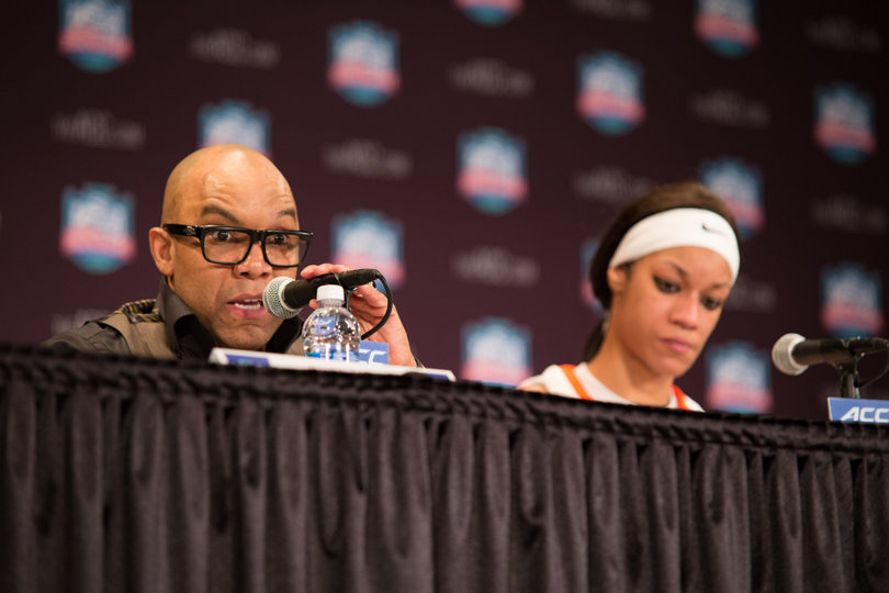 Syracuse head coach Quentin Hillsman and center Briana Day address the media after the game.