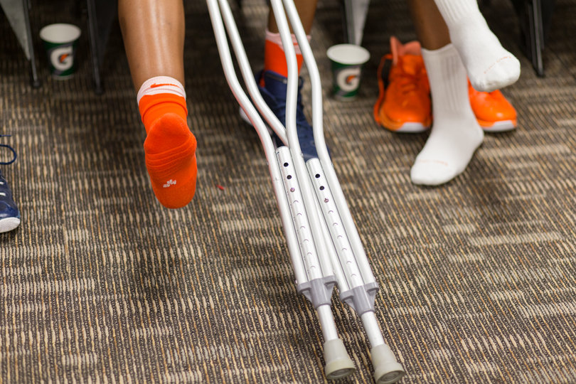 Ford keeps her foot elevated in the locker room after the game. She entered the locker room on crutches after scoring 10 points, her third most of the season.