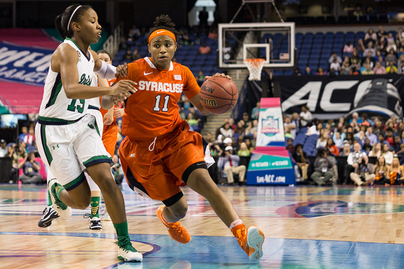 Syracuse guard Cornelia Fondren drives to the basket through the paint, bodying up against Allen.