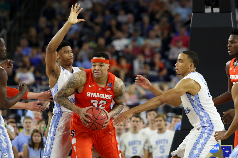 Coleman gets double teamed by North Carolina's Johnson (right) and another defender.