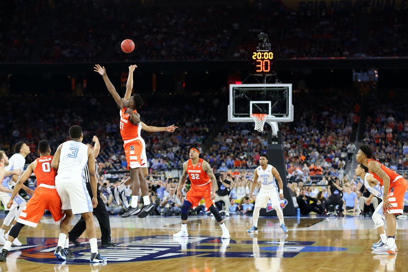 Tyler Roberson and Brice Johnson tip off at the start of Syracuse's Final Four matchup with North Carolina. 