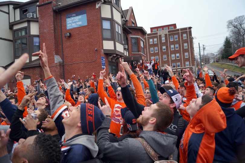 Students raise their arms to music at Castle Court.