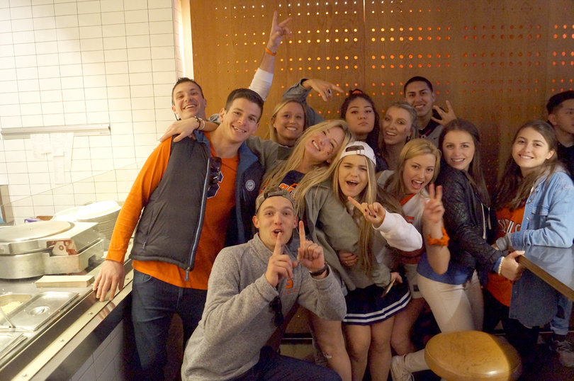 Syracuse fans pose for a photo in a Marshall Street store on Saturday.
